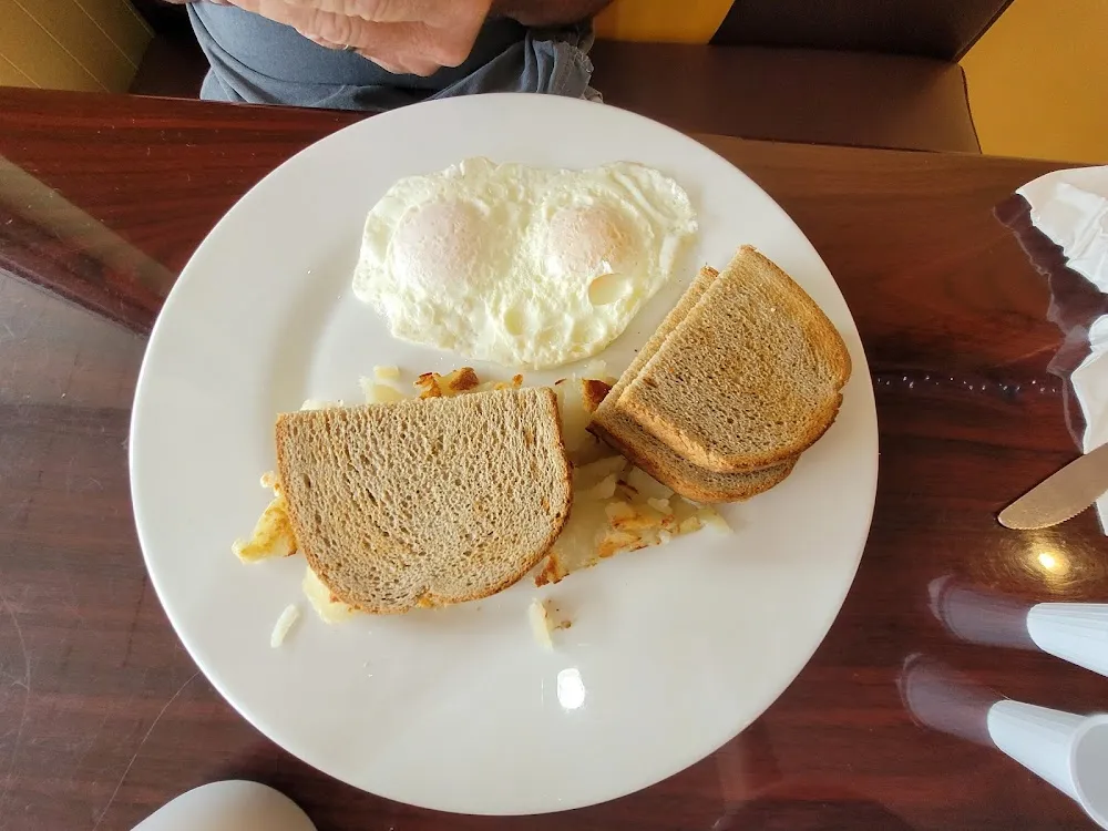 Two Eggs over Light with Home Fries and Rye Toast